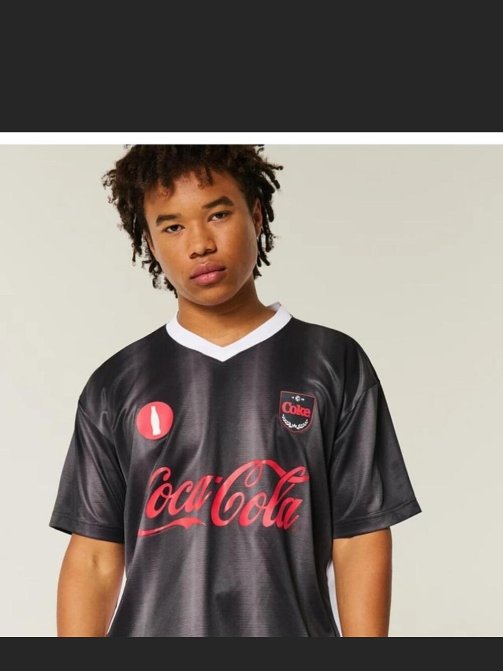 Hollister Black Jersey with Red Coca-Cola Graphics